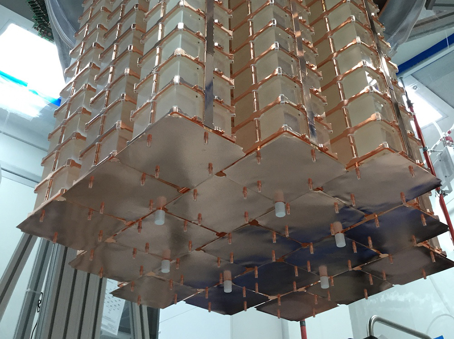 CUORE detector being installed into the cryostat.