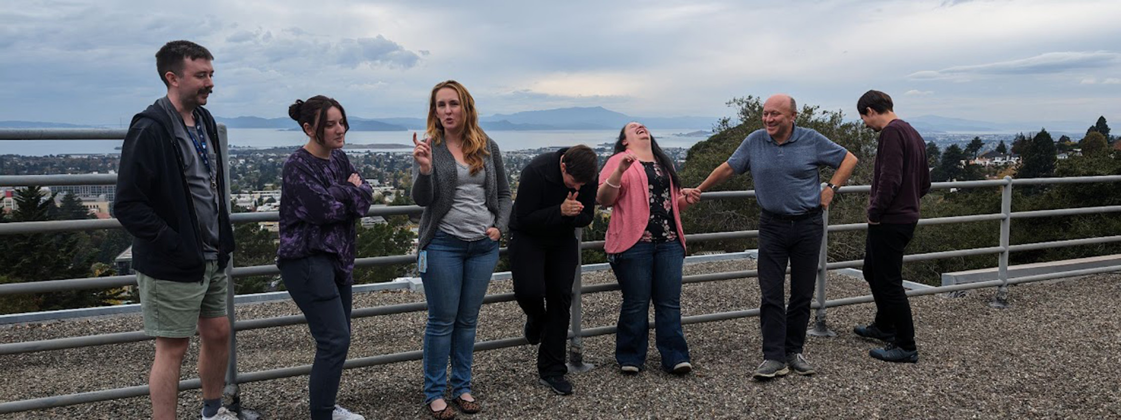 Members of the Heavy Element Group relaxing before a posed outdoor photo