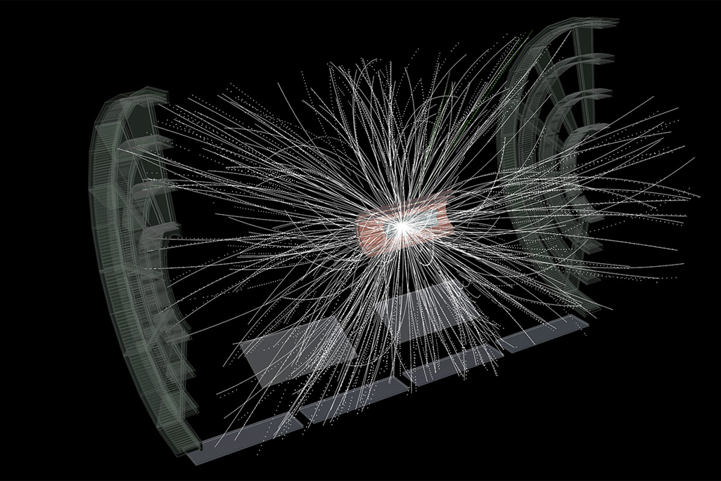 Image depicting particles bursting outward in RHIC’s new sPHENIX detector after gold ions collide and create a puff of quark-gluon plasma