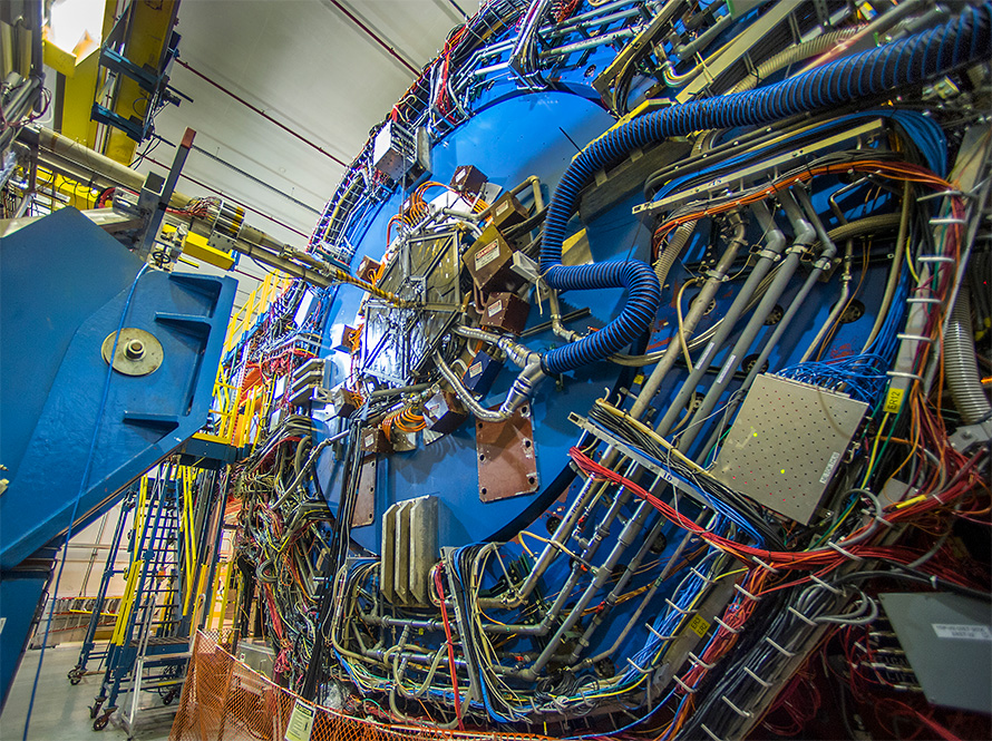 Pipes and cables on the exterior of the large blue STAR detector.