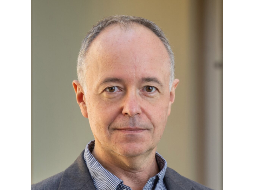 A while male with a grey shirt jacket.